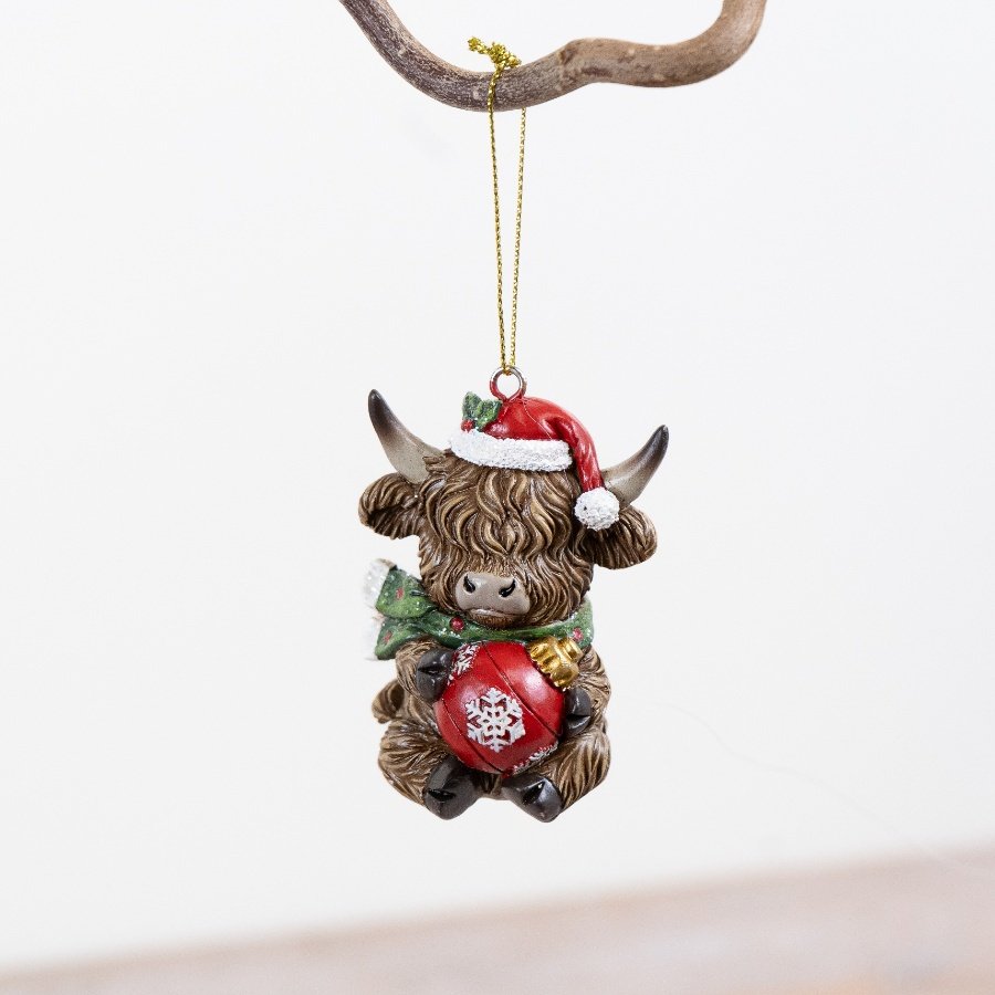 Bring holiday cheer with this Resin Highland Cow Ornament, perfect for festive Christmas décor.