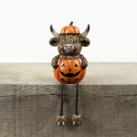 Bring cozy fall vibes with the Rsn Halloween Highland Cow Pumpkin Shelf Sitter decoration.
