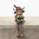 Bring holiday cheer to your space with the RSN Christmas Highland Cow Shelf Decor.