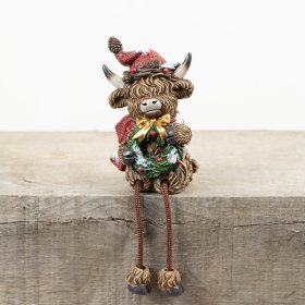 Bring holiday joy to your space with the RSN Christmas Highland Cow Shelf Sitter.