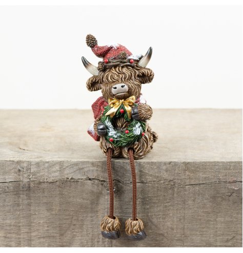 Bring holiday cheer to your space with the RSN Christmas Highland Cow Shelf Decor.