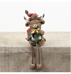 Bring holiday cheer to your space with the RSN Christmas Highland Cow Shelf Sitter.