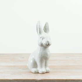 Elegant ceramic rabbit sculpture featuring a sleek finish and charming design.