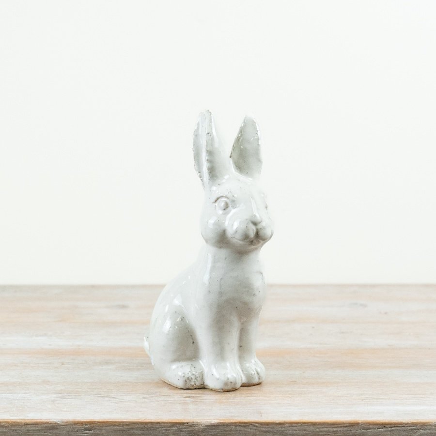 Elegant ceramic rabbit sculpture featuring a sleek finish and charming design.