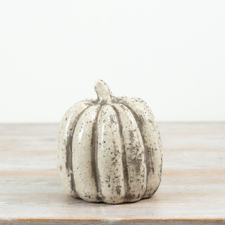 Add rustic charm to fall decor with this elegant ceramic pumpkin, perfect for autumn displays.