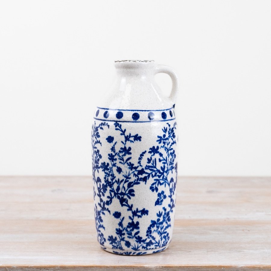 Bring timeless elegance to your interiors collection with this beautifully crafted blue and white ceramic jug vase.