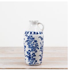Elevate your classic interiors offering with this elegant blue and white ceramic jug vase.