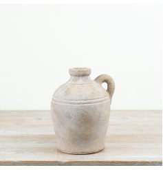 An earthy and rustic vase with a Mediterranean farmhouse feel. Complete with a timeless, weathered character.