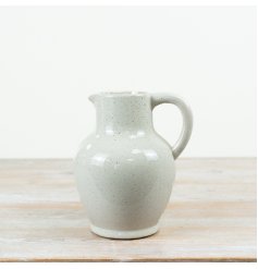 a chic jug featuring a softly rounded silhouette with a classic curved handle and pouring lip
