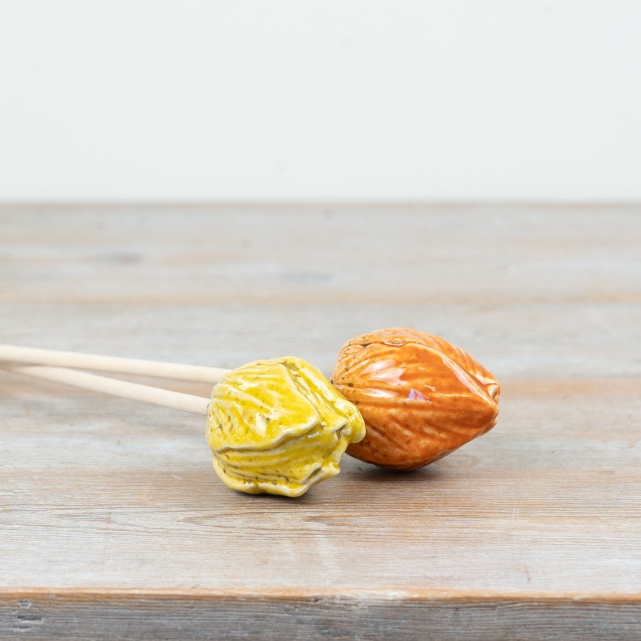 Brighten your home or garden with this vibrant speckled yellow and orange tulip.