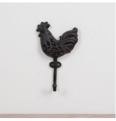Bring rustic charm to your space with this intricately designed brown cock hook.