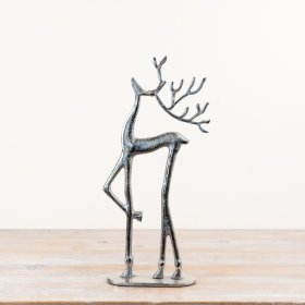 Adorable reindeer figure standing on a sturdy base.