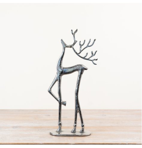 Adorable reindeer figurine standing on a decorative base.