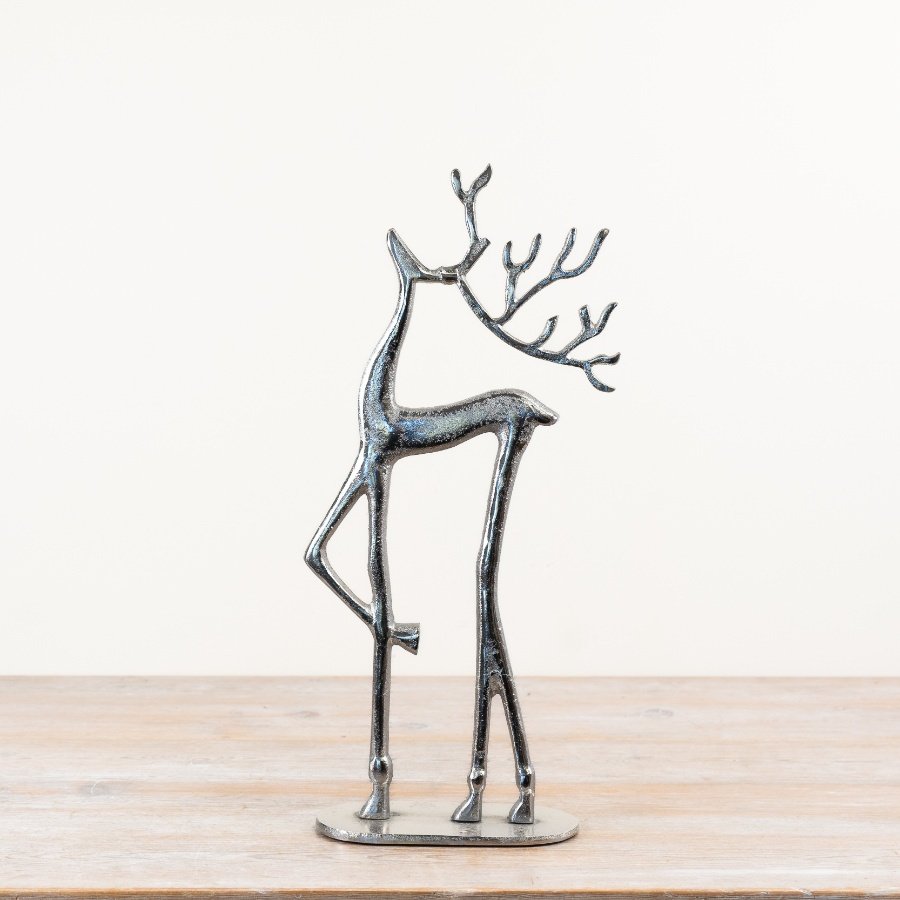 Adorable reindeer figure standing on a sturdy base.