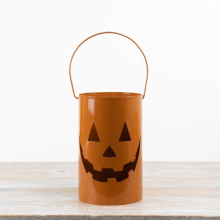 a stylish orange lantern with handles 