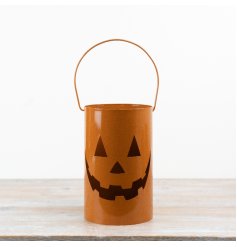 a stylish orange lantern with handles 