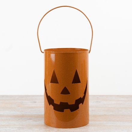 A charming pumpkin design lantern with handles 