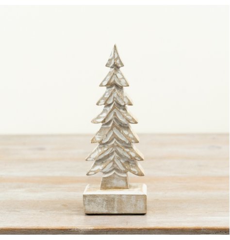 Minimalist wooden ornament shaped like a tree, perfect for festive decor.