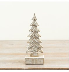 Minimalist wooden ornament shaped like a tree, perfect for decorating any space.
