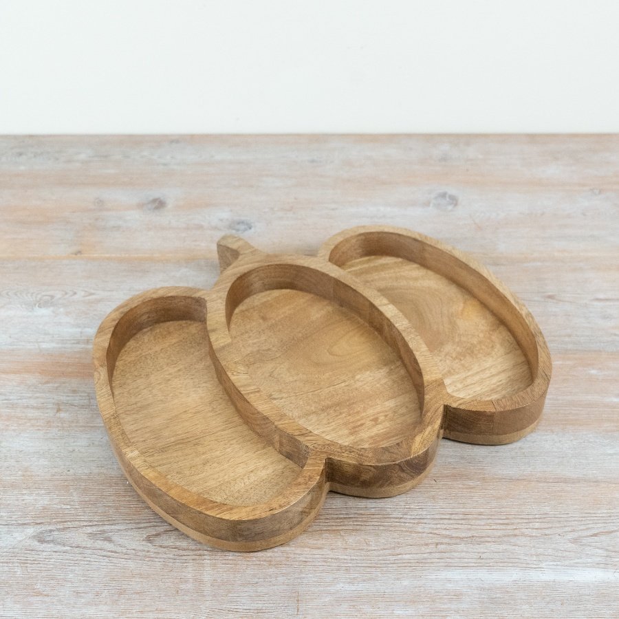 Bring fall vibes to your table with this cozy pumpkin wooden serving platter.