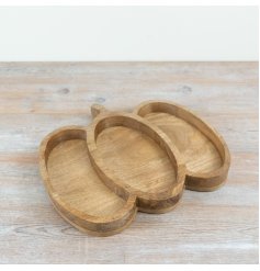Bring fall vibes to your table with this charming pumpkin-shaped wooden serving platter.