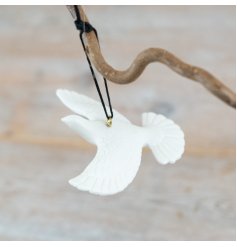 Elevate your decor with this elegantly crafted hanging dove, perfect for adding subtle charm to any space.