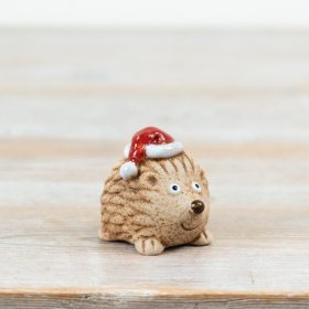 Bring instant festive charm to your range with this cute ceramic hedgehog Christmas decoration.