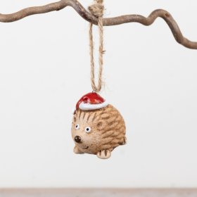 Part of the Rosy Eyes collection, this ceramic hedgehog ornament features textured detailing