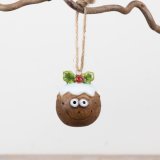 Bring festive warmth to your holiday with this charming Christmas pudding tree hanger.