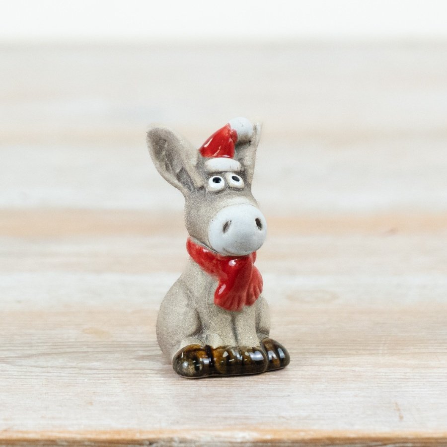 Bring a touch of festive fun to your range with this delightful ceramic donkey Christmas decoration.