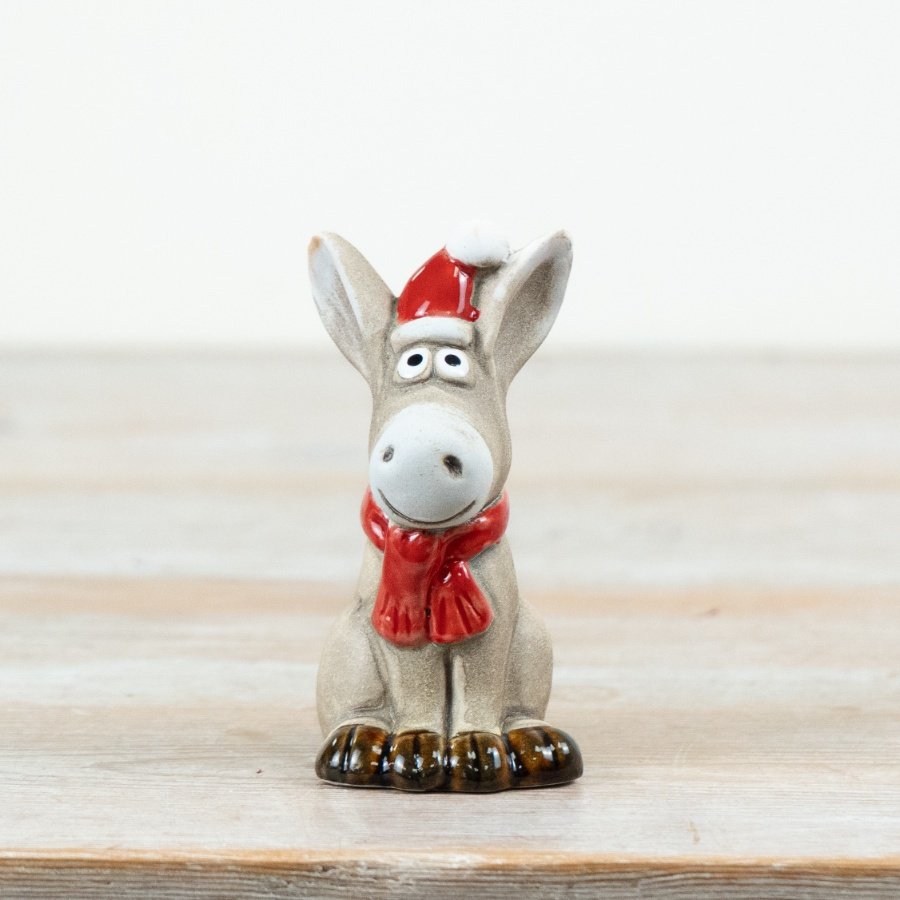 Charming 10cm ceramic donkey ornament in a cute sitting position.