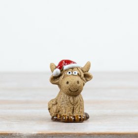 this 6cm ceramic Highland cow is designed in a compact sitting pose