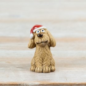 This charming festive dog decoration is full of character and seasonal appeal.