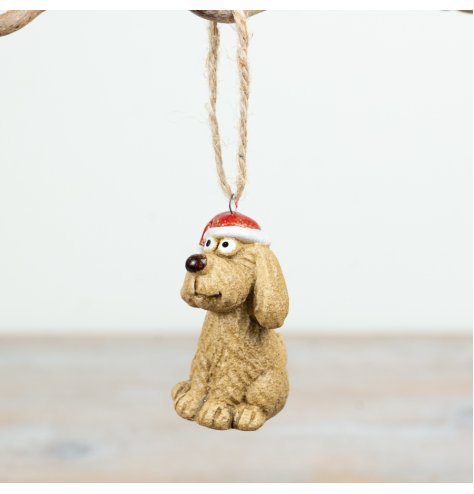 Festive hanging dog ornament featuring a textured stone-look and a bright red Santa hat.