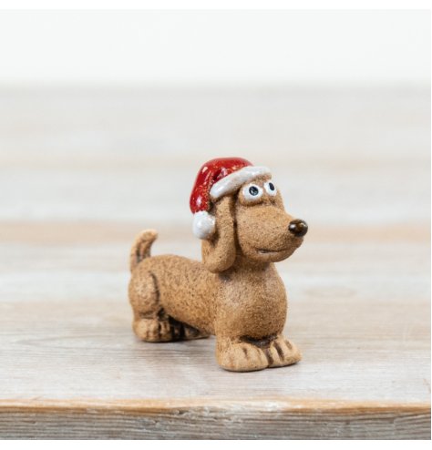 Add festive joy to your collection with this adorable dog Christmas decoration.