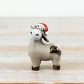 Bring playful charm to Christmas displays with this characterful donkey ornament, finished with a festive red Santa hat.