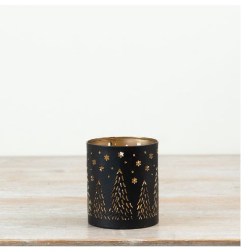 A delightful candle holder featuring intricate cut-out designs.