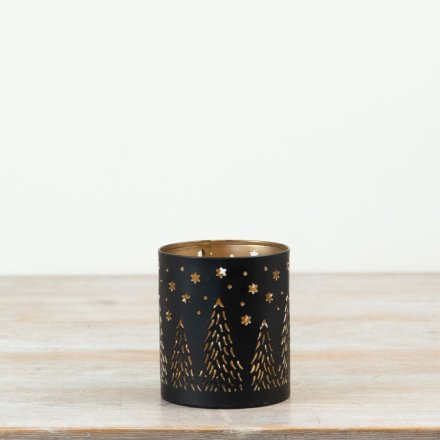 A delightful candle holder featuring intricate cut-out designs.