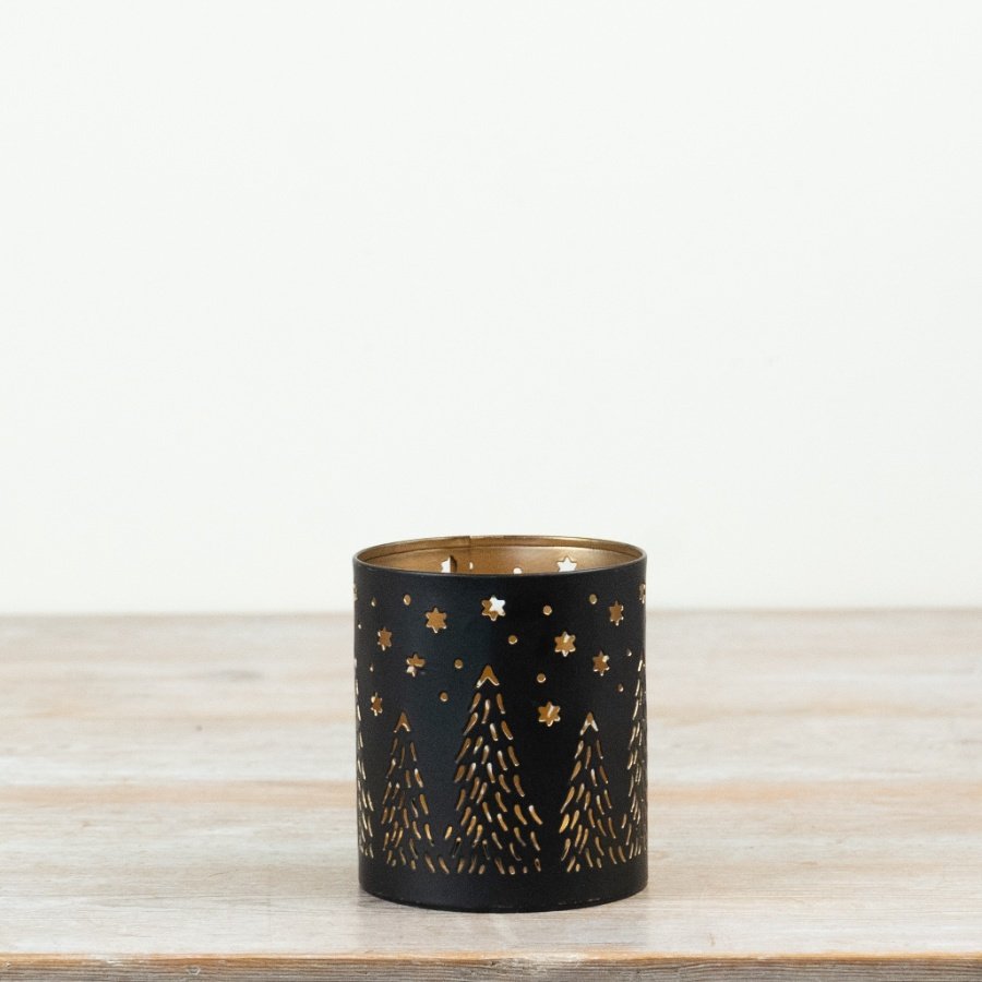 Delightful candle holder with elegant cut-out design.