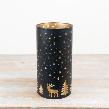 Add a touch of elegance with this black and gold iron votive holder for any room.