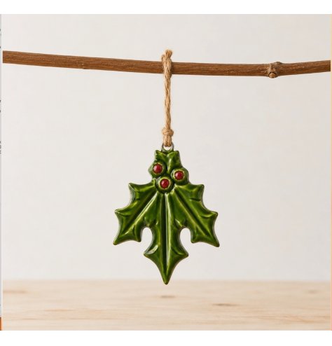 Add a timeless, festive touch to your mantelpiece or sideboard with this charming holly adornment
