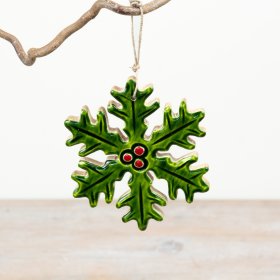 A festive hanging decoration crafted in the shape of a stylised holly leaf, finished in a rich green glaze 
