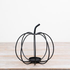 Sleek black pumpkin-shaped candle holder for a chic, seasonal touch.