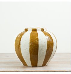 Decorative ceramic vase featuring a rounded shape and striking vertical stripes in warm neutral shades.
