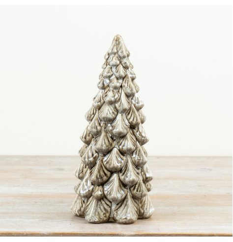 A sculptural tree, featuring a soft neutral glaze and rich layered texture.