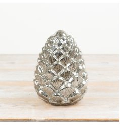 This illuminated glass pine cone adds instant festive sparkle. 