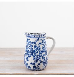 Blue and white ceramic jug featuring a floral pattern and a softly distressed vintage look.