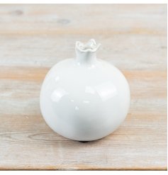 Glazed ceramic vase featuring a vibrant pomegranate design.