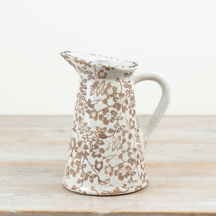 Chic jug vase featuring a beautiful floral pattern.