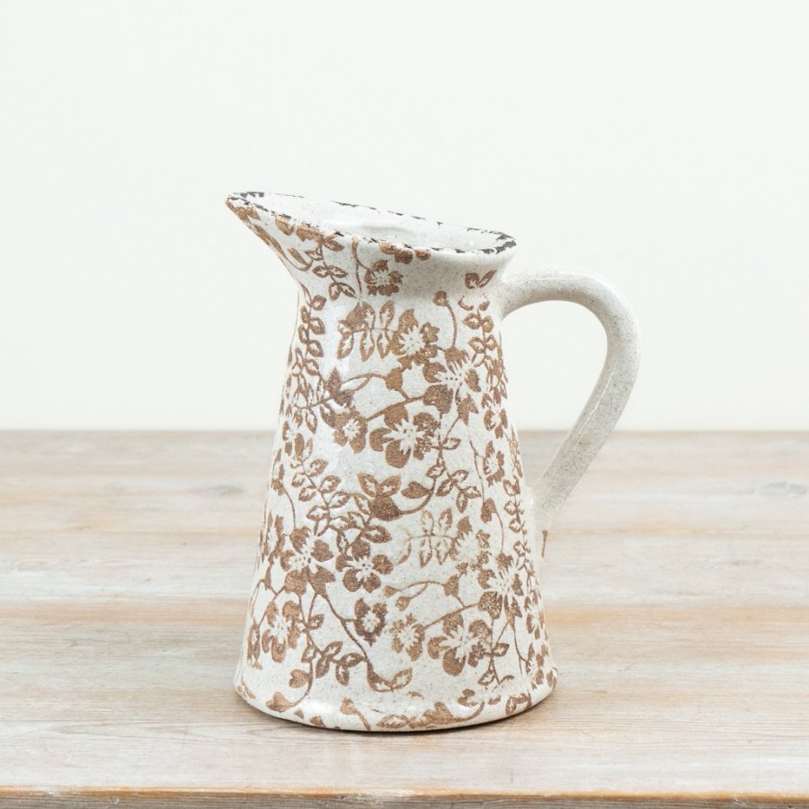 Elegant jug vase featuring a chic floral pattern.
